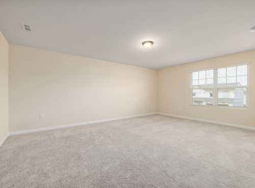 This is a photo of an empty room with cream carpets works carried out by Buckhurst Hill Carpet Cleaning